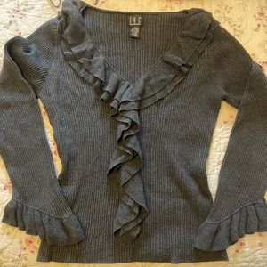INC charcoal sweater with ruffle fringe around neck and bell sleeves